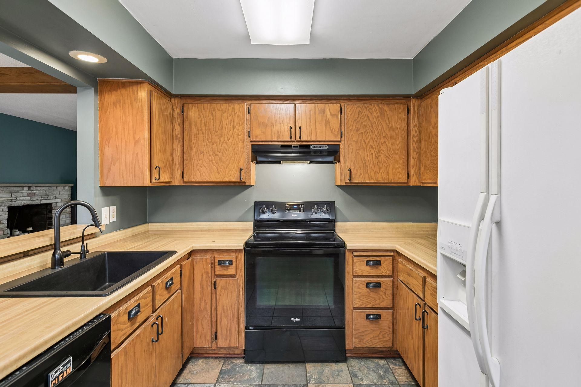 The kitchen offers a large farm sink!