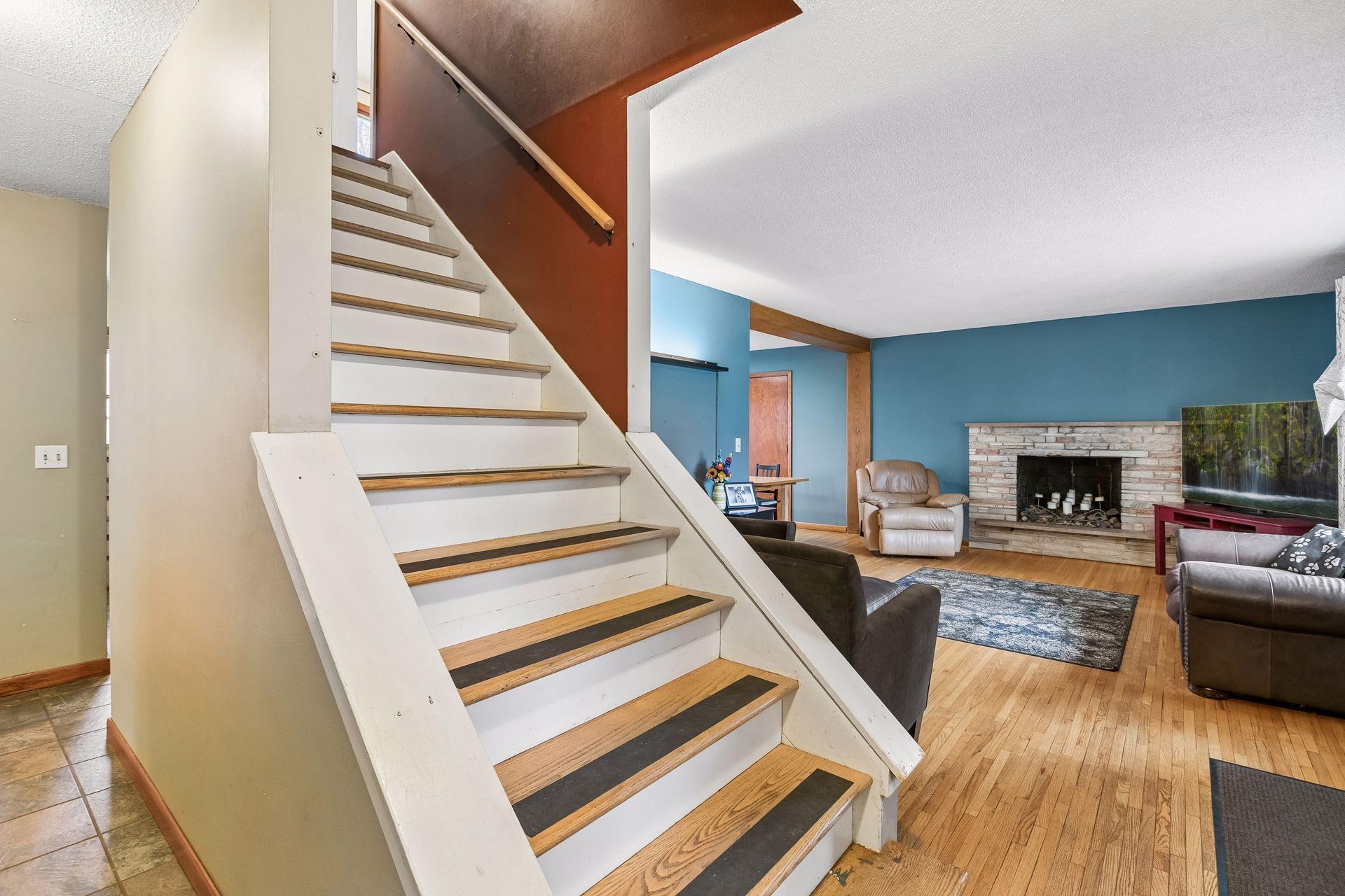 The home features center staircase to the large upper level