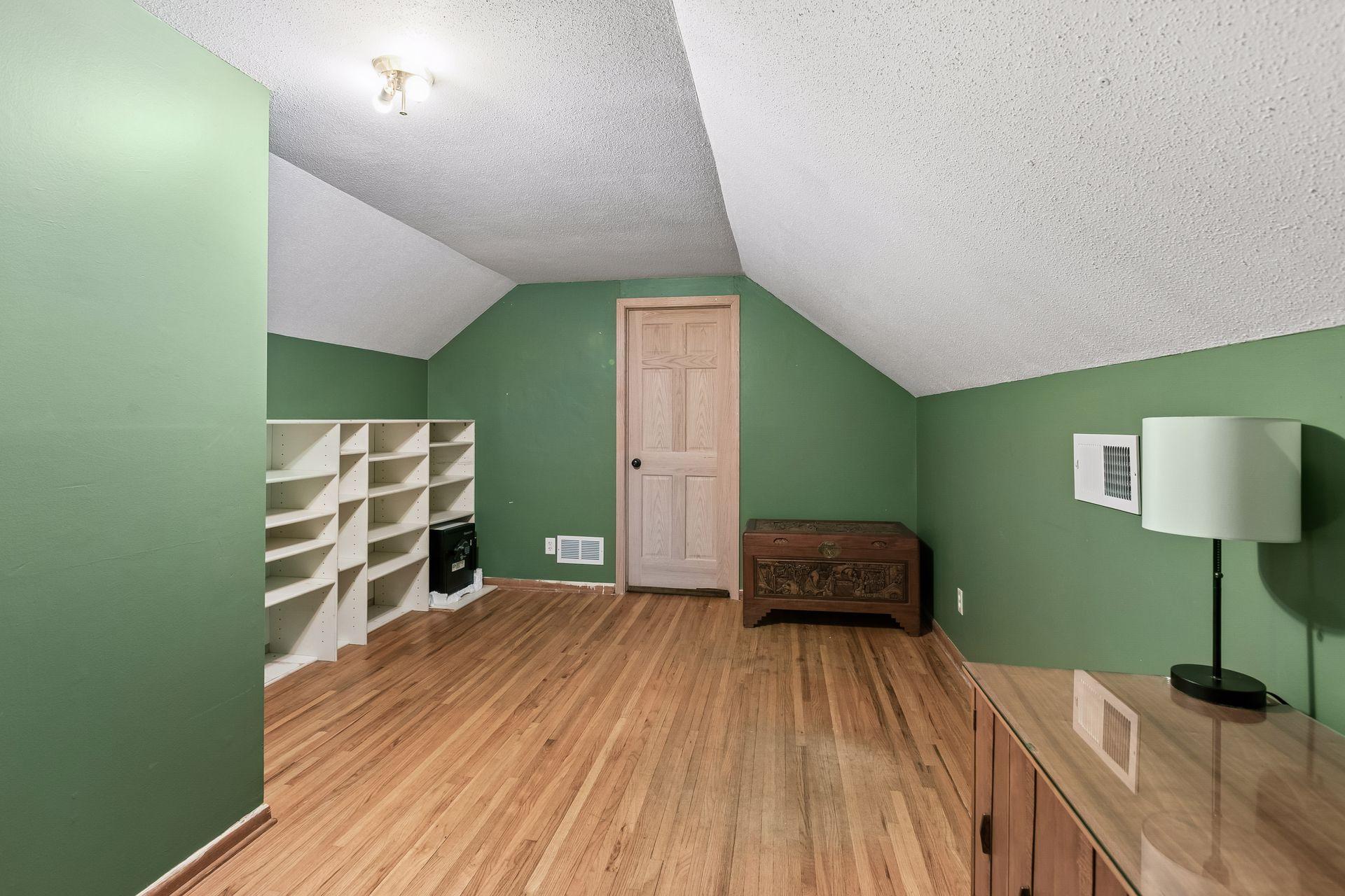 Great wood floors - 5th bedroom is just beyond the door - currently used as a storage room