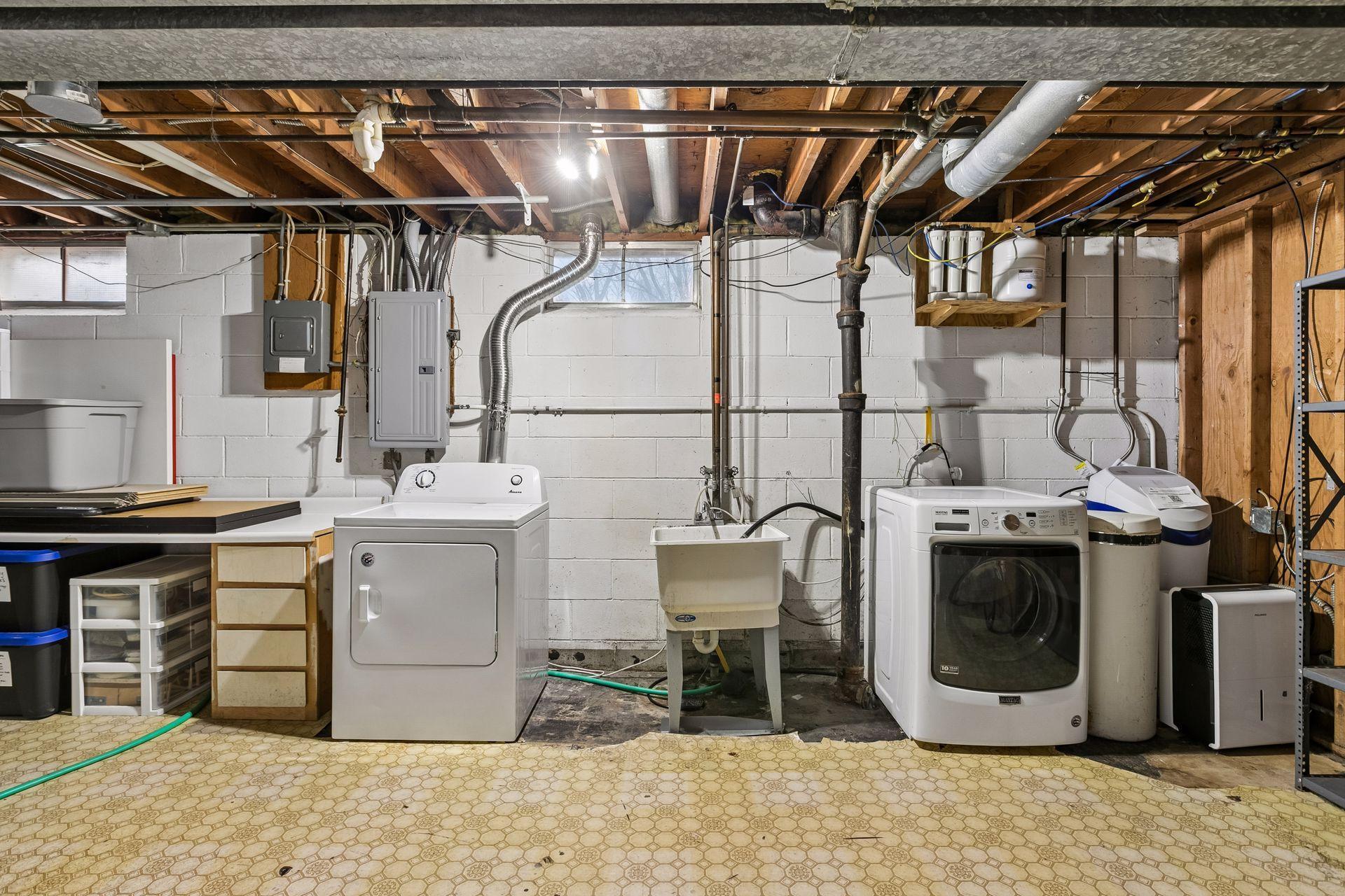 The lower level laundry room is spacious and has a laundry tub!