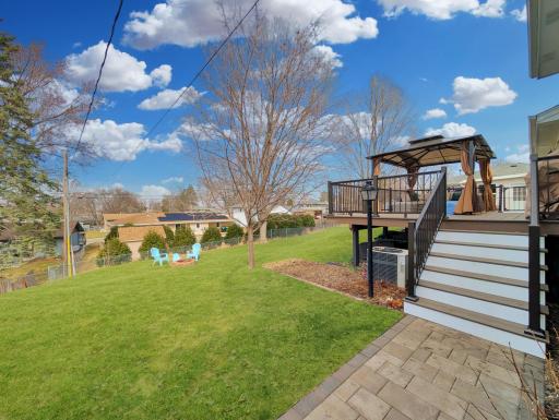 This spacious backyard features a fireplace and plenty of space!