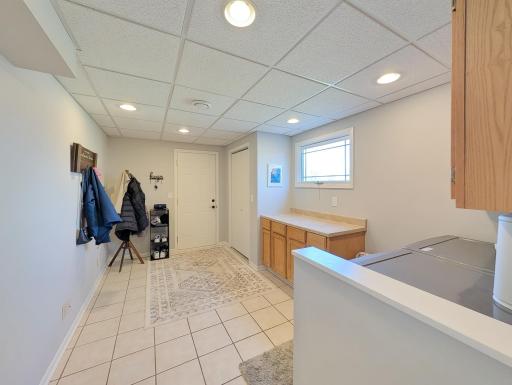 Large laundry/mud room leading to the attached garage.