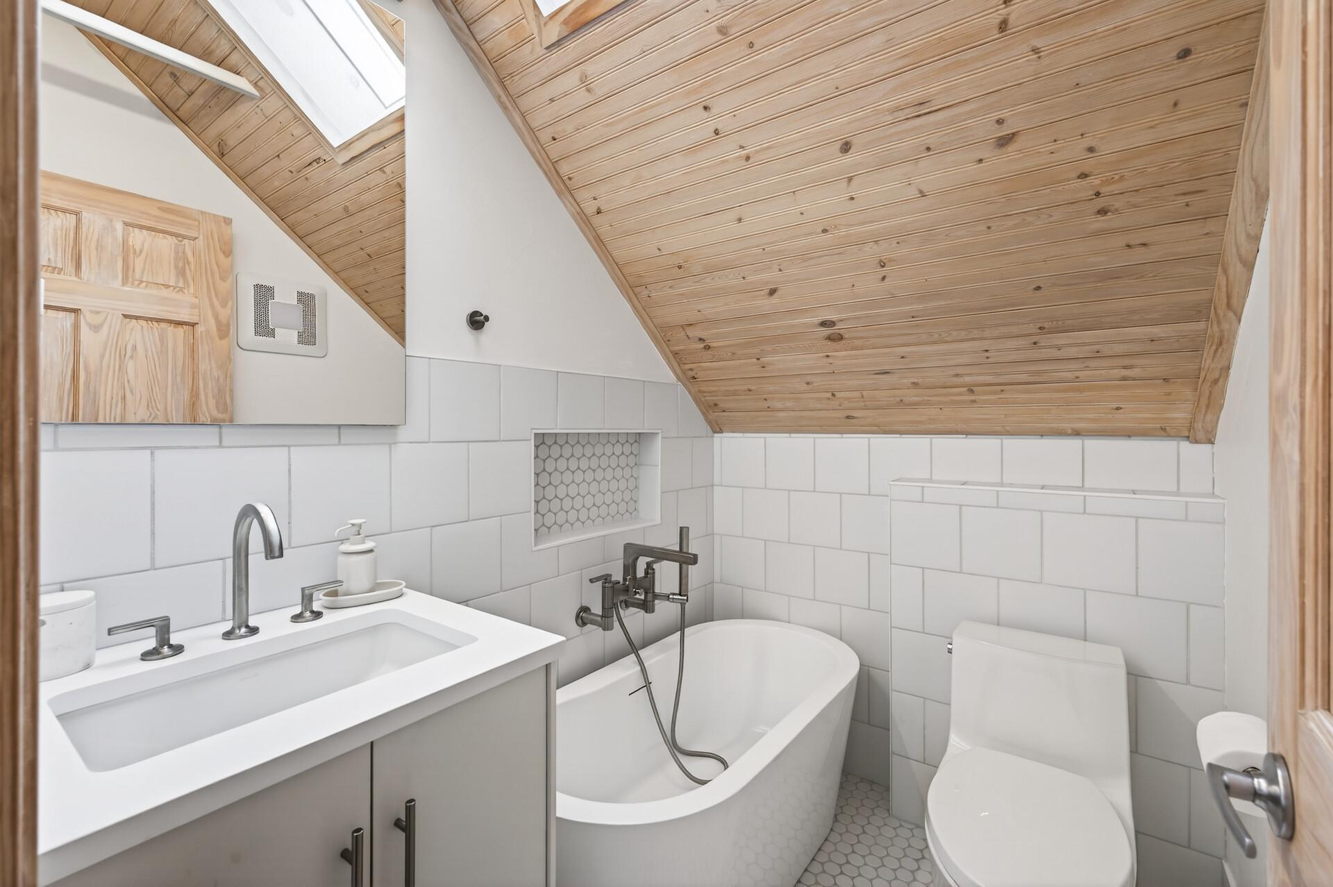 Upper level bathroom with a new skylight installed in 2025!