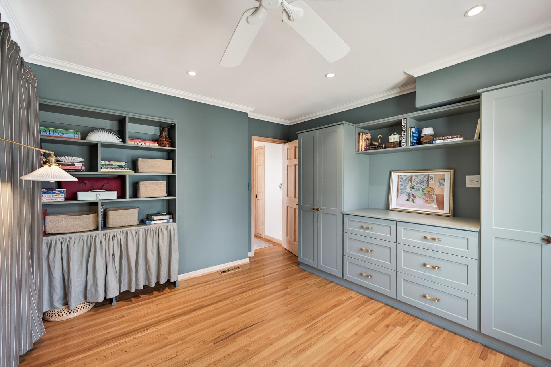 Primary bedroom with gorgeous custom built-ins, maximizing storage space
