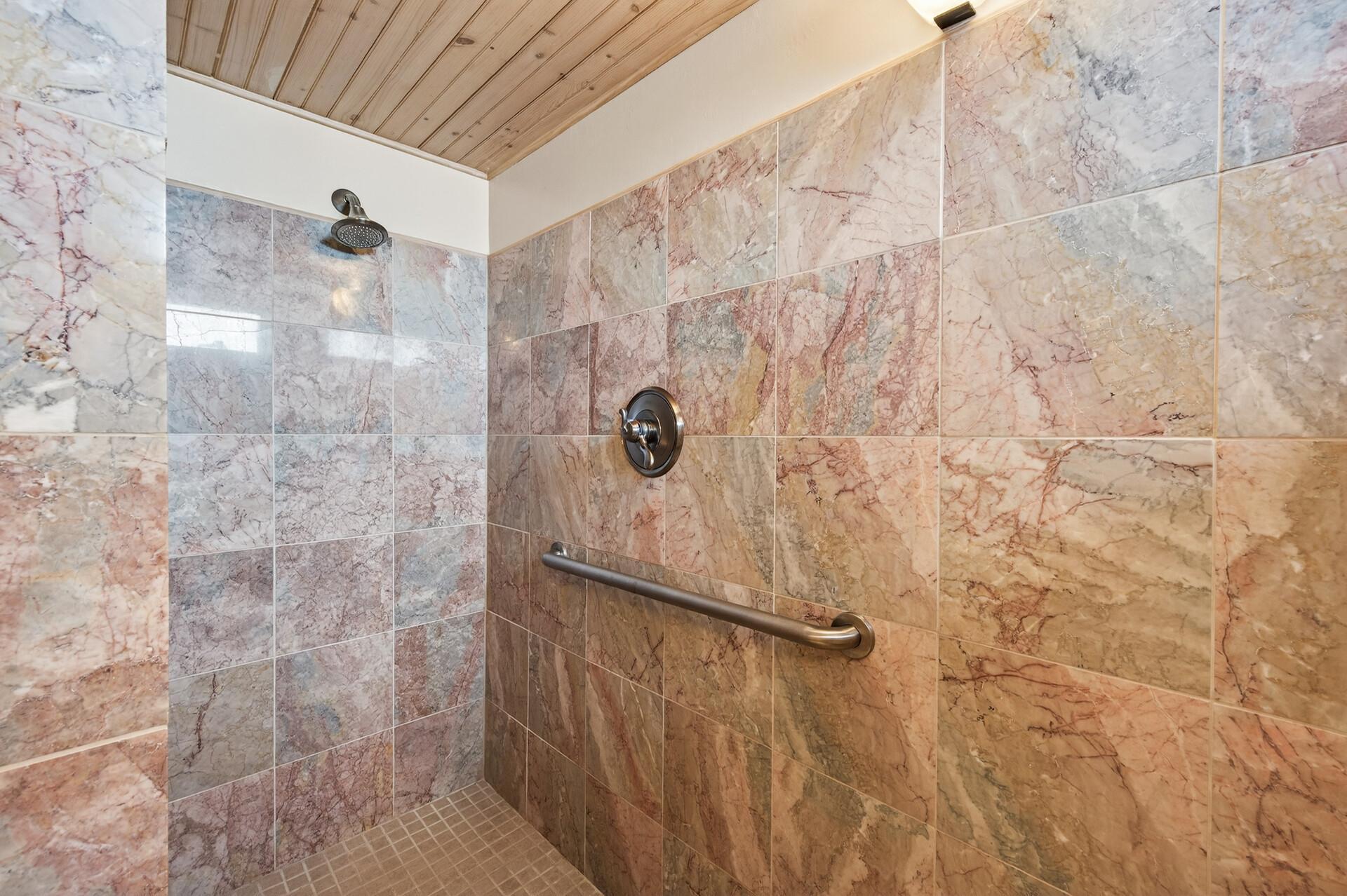 Oversized walk-in shower in the lower level bathroom