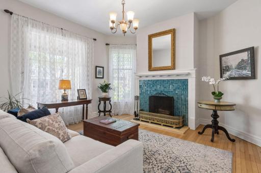 Original teal tile is the focal point of the living room.