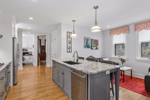 Connect with family and guests in the eat-in kitchen with attached sitting room.