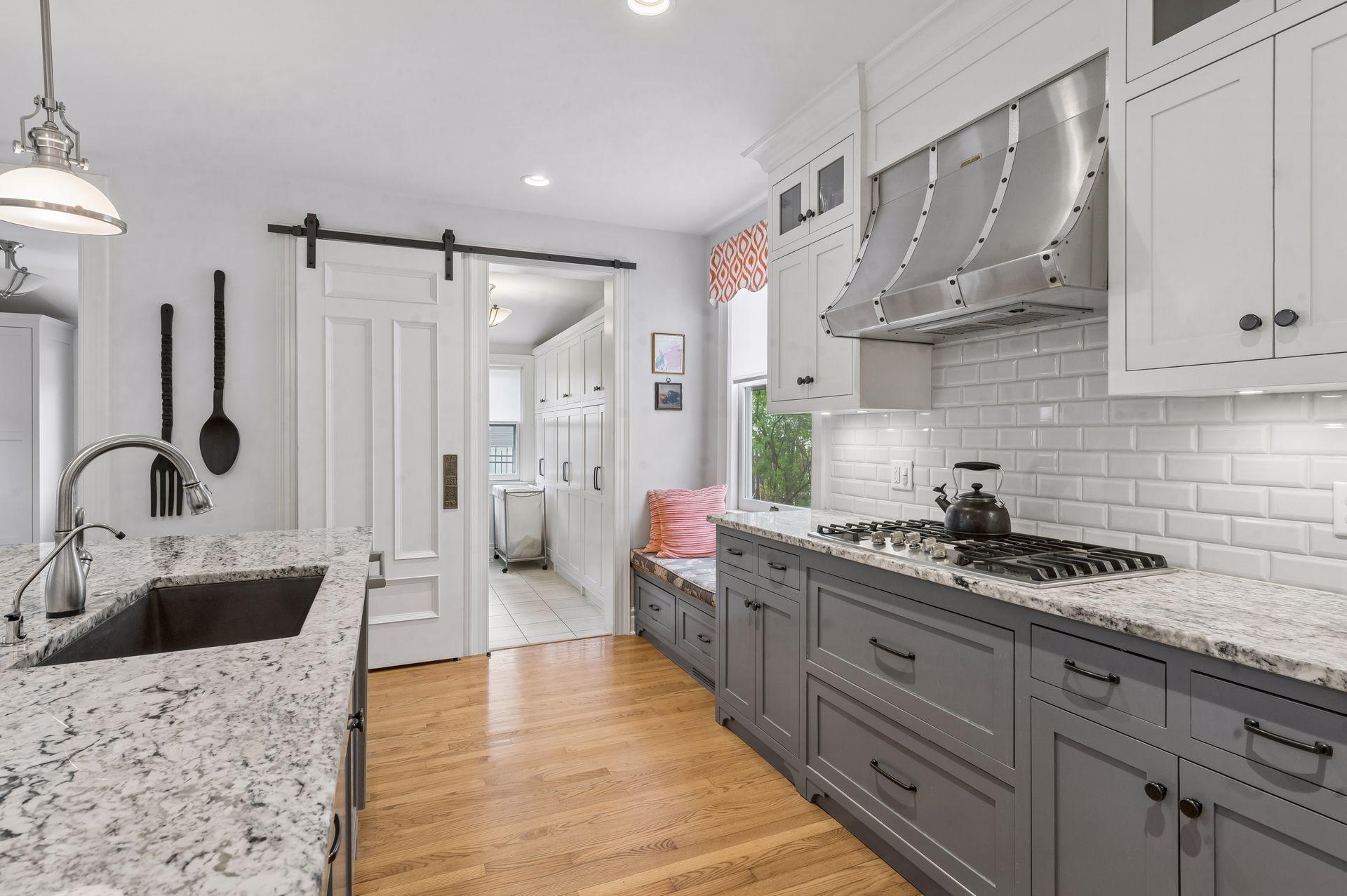 Keep your laundry out of site with a vintaged door that has been retrofitted to slide with ease.