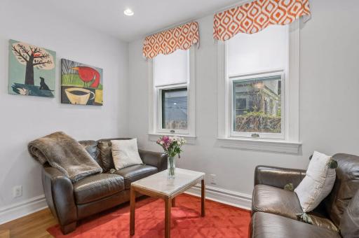 The cozy sitting room off of the kitchen island is ideal for entertaining or morning coffee.