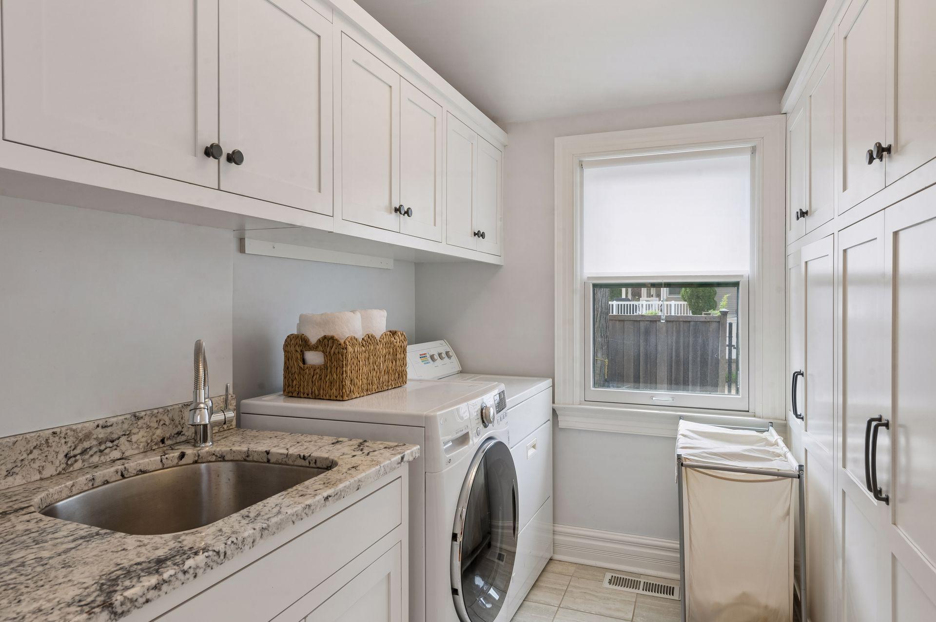 Laundry is a breeze in this beautiful main floor laundry room.