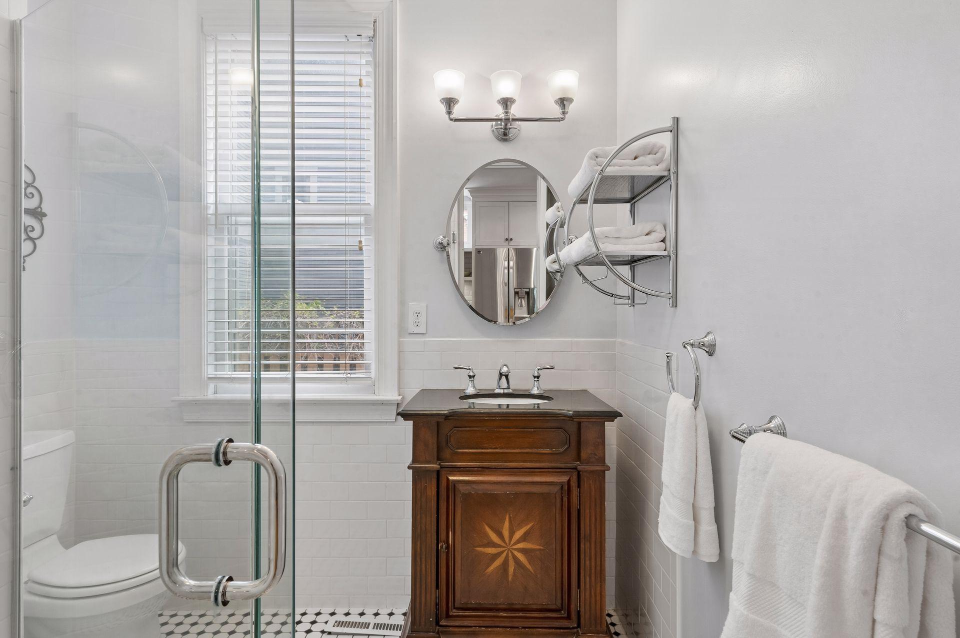 The main floor bathroom has a vintage flair with the convenience of a shower on this level.