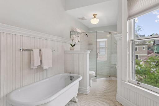 A full four-piece bathroom with claw-foot tub and huge walk-in shower on the second floor.