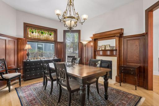 Breathtaking natural woodwork and another gas fireplace in the formal dining room.