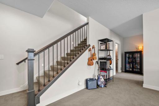 Descend downstairs to a spacious walkout family room, 2 additional bedrooms, an exercise/flex room, and plenty of storage space in the utility room
