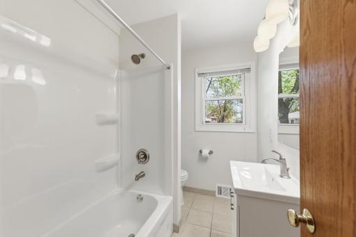 Totally updated main floor bathroom with ceramic tile floors, new shower and vanity.