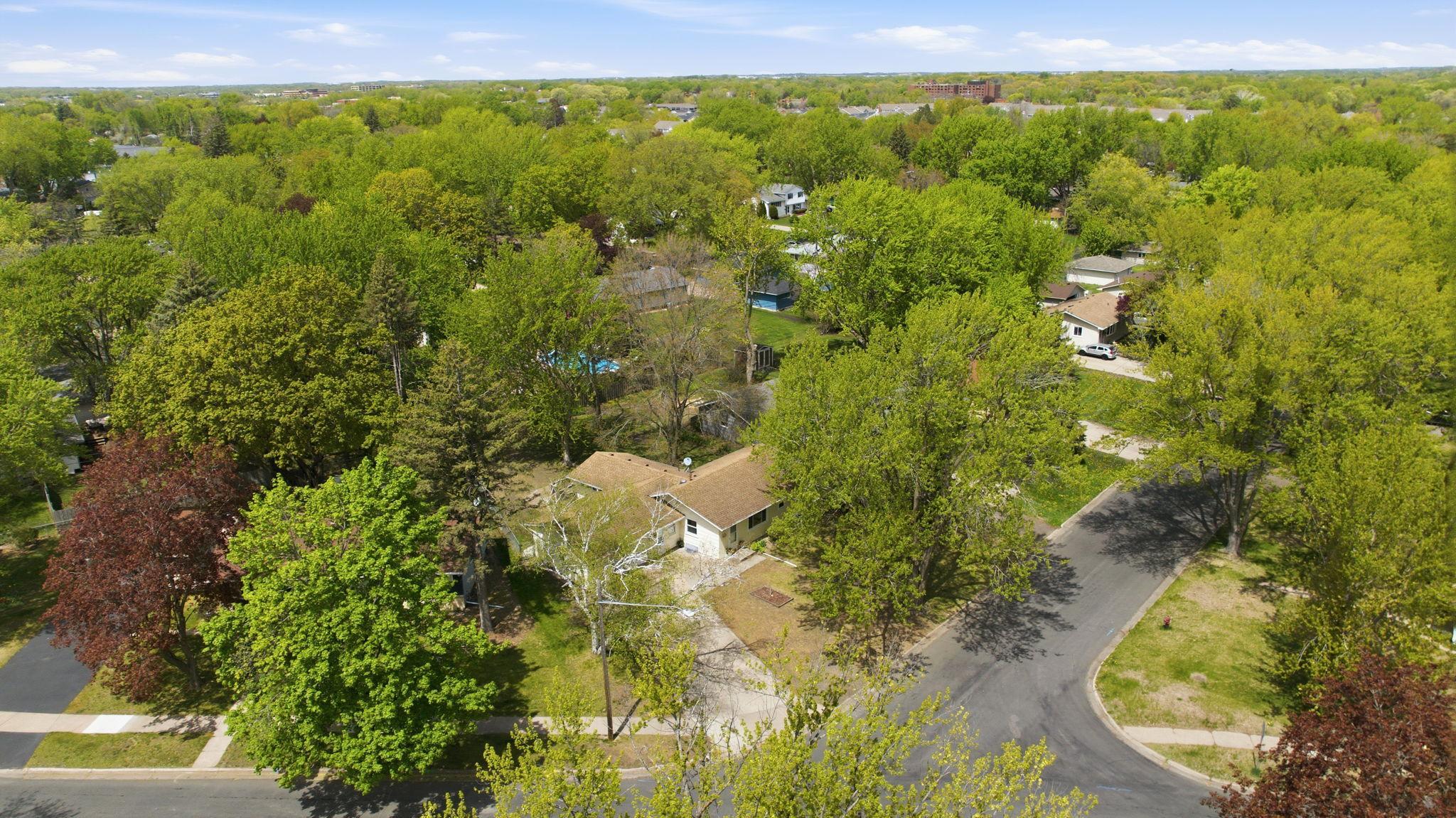 Mature trees line the streets of this quiant neighborhood.