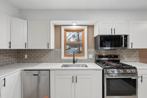 beautiful subway tile and window over the sink.jpg