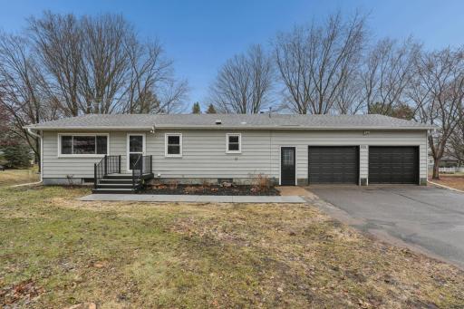 New concrete walkway into home, new garage doors and all new landscapting.jpg