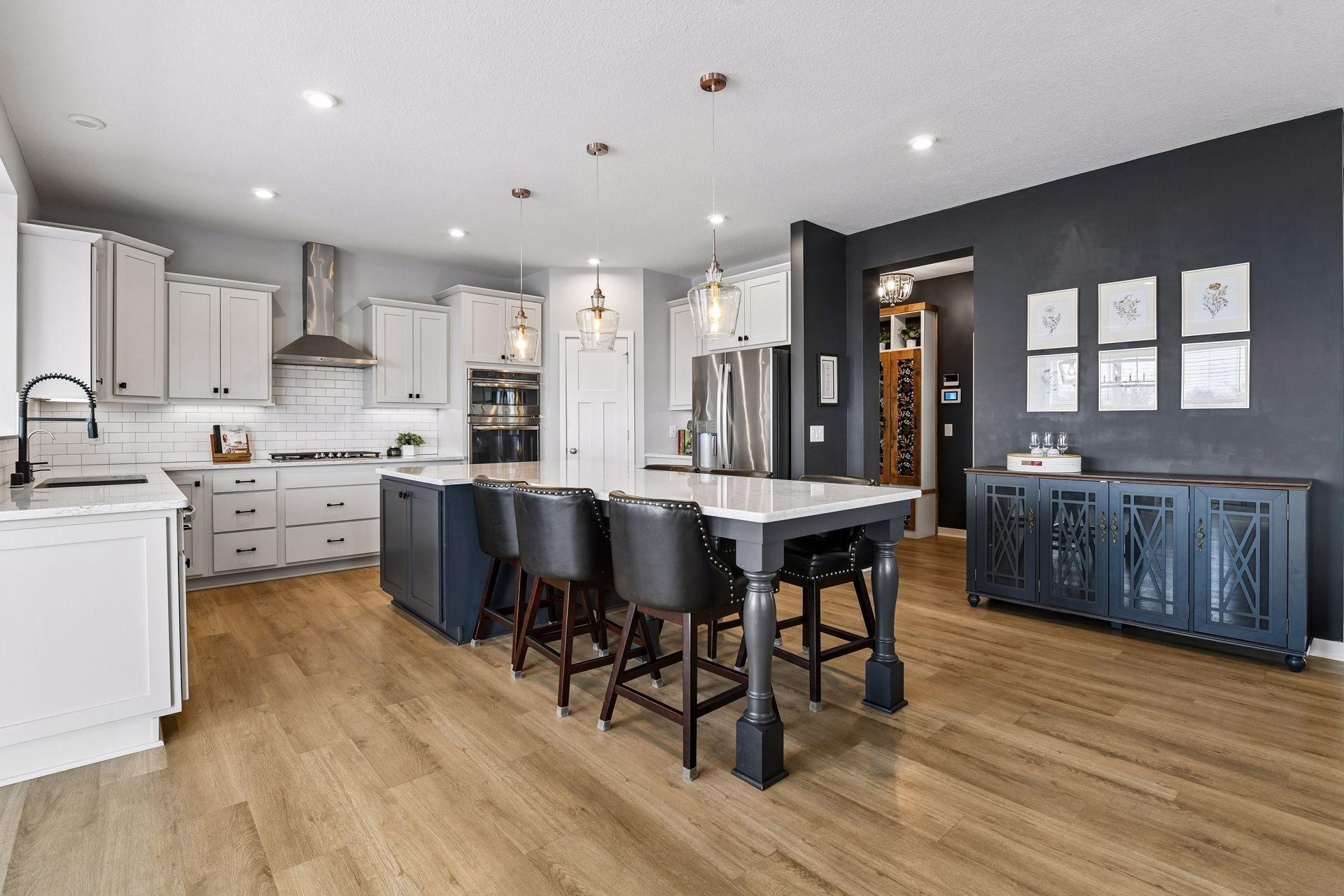 Kitchen built for entertaining, this gormet style kitchen features extended island, stainless steel appliances, gas cooktop and vent hood