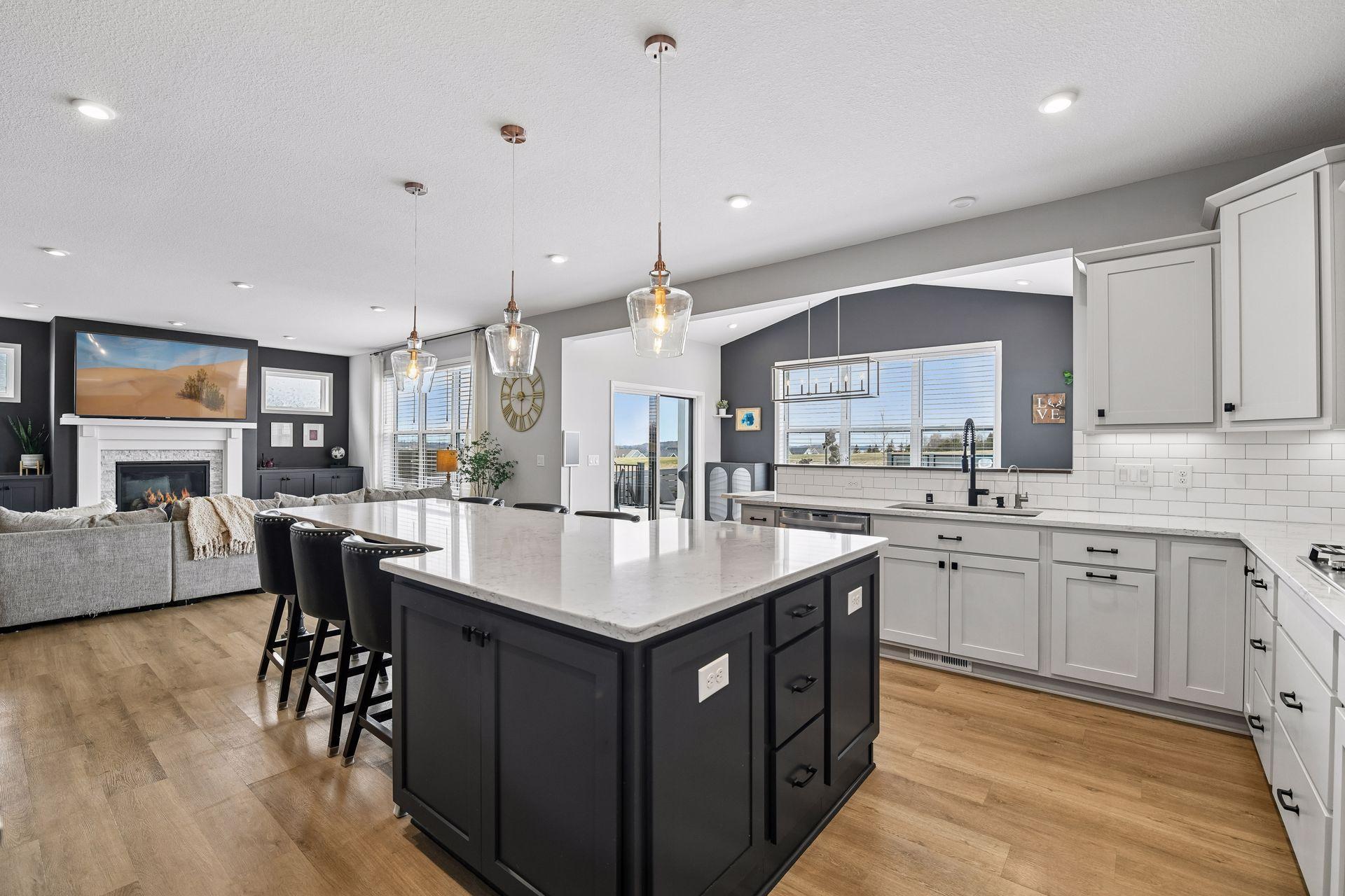 North-facing windows, quartz island, and a layout that keeps everyone in the conversation.