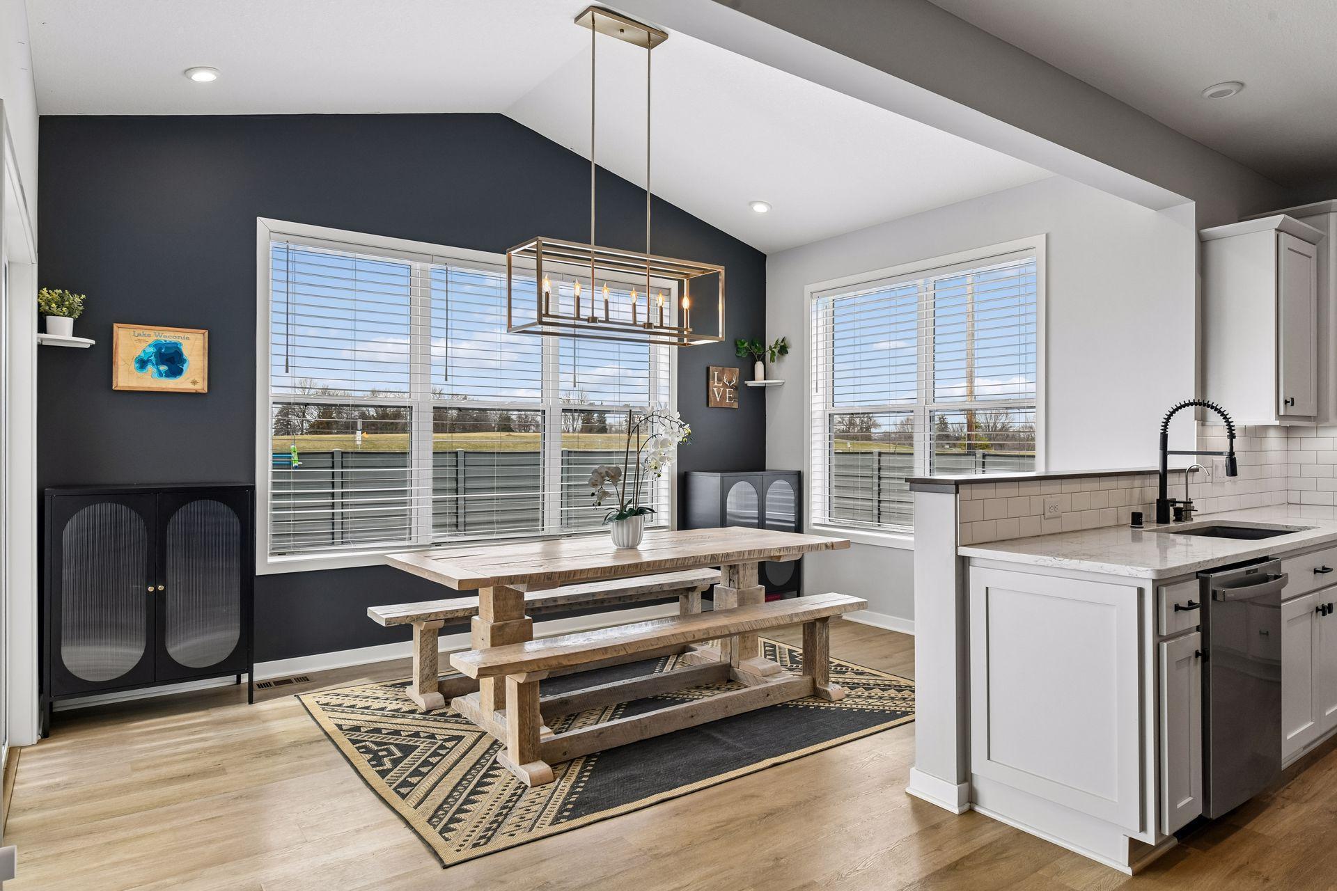 Formal dining space offers oversized windows and sliding glass door that walks you right outside to outdoor entertaining space