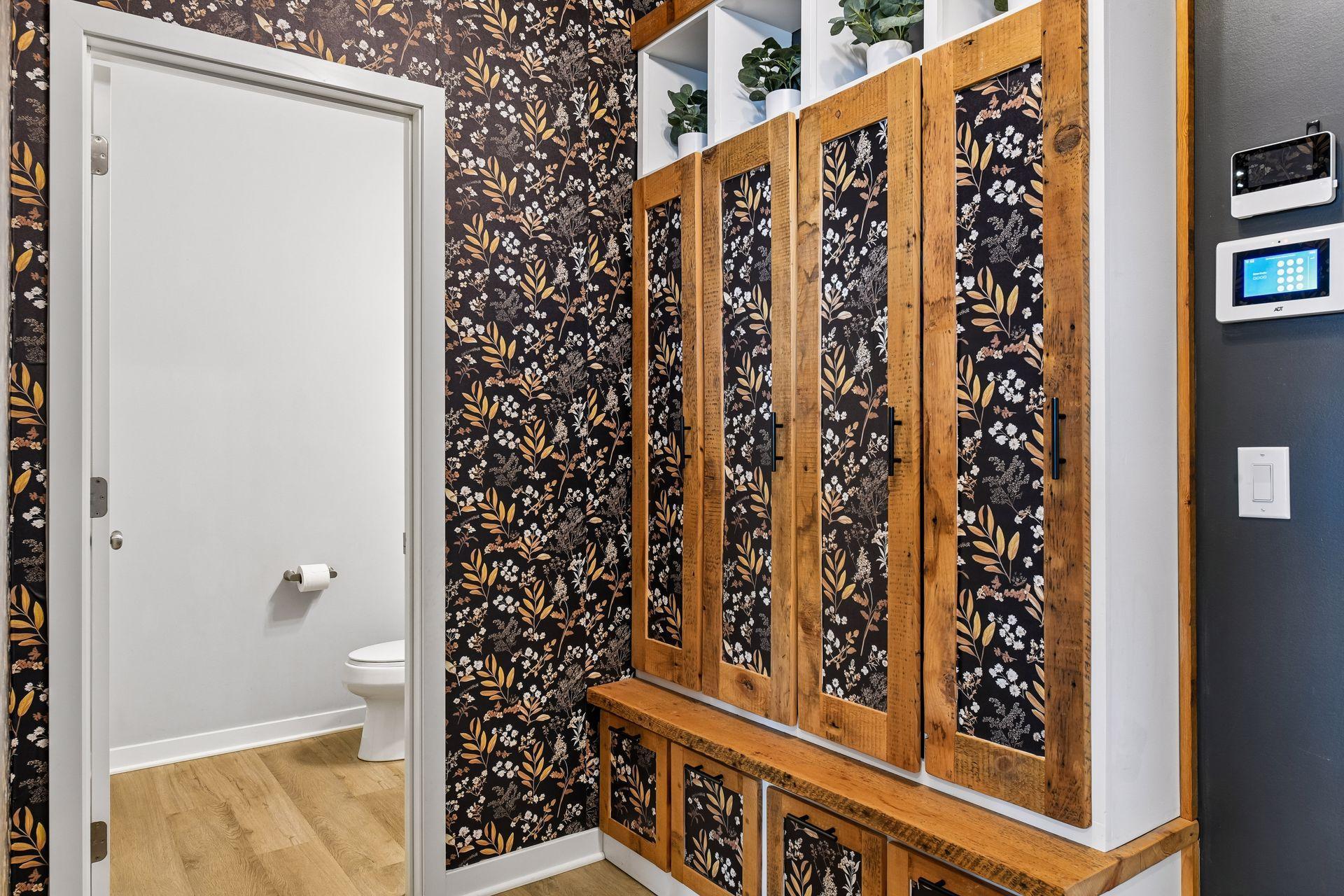 Right off the garage you will find custom built in's and half bathroom