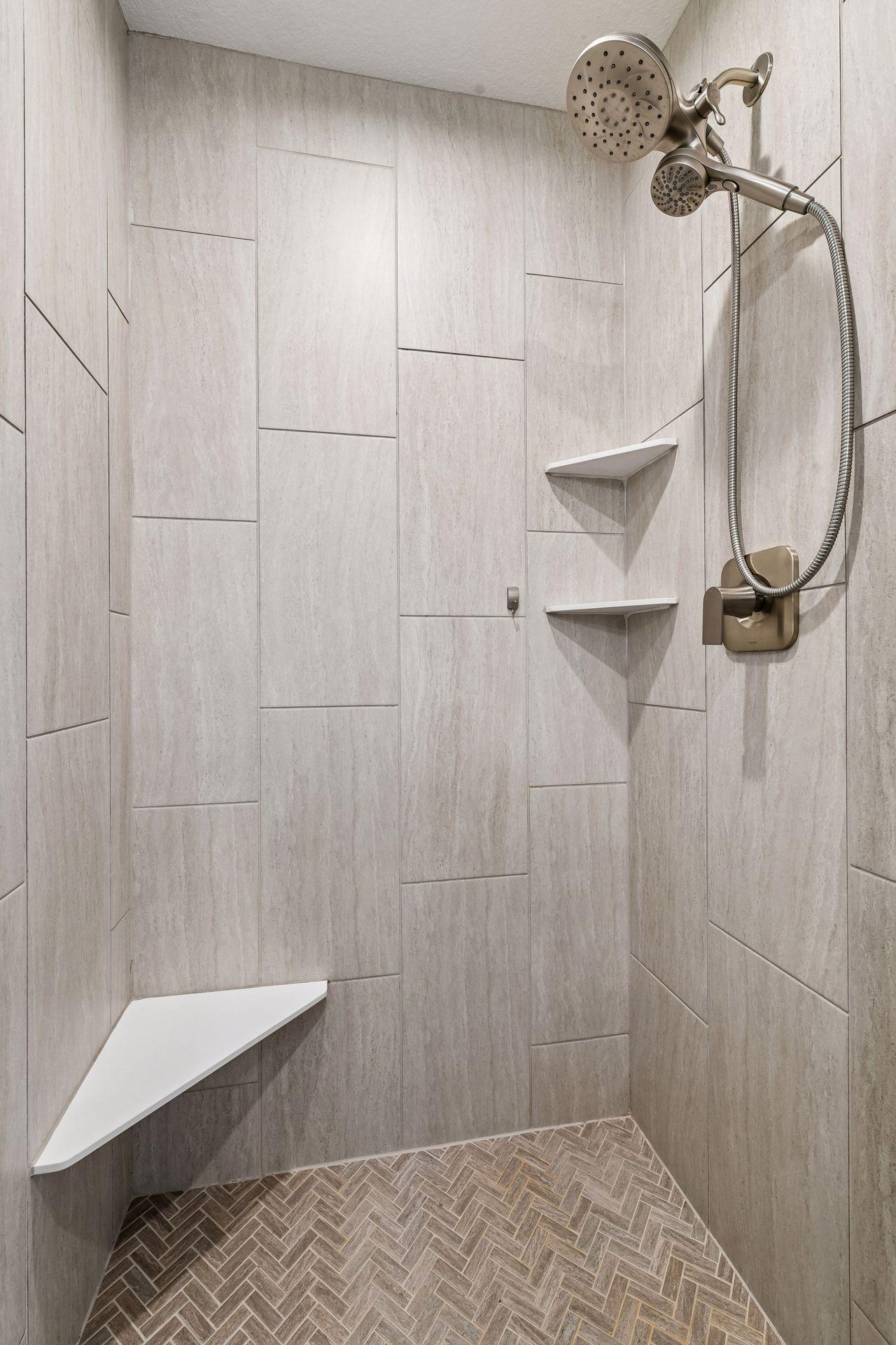 Primary spa like bathroom with tiled walk in shower