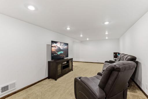 Soft, brand-new carpeting adds warmth underfoot, creating a clean, comfortable setting perfect for relaxing or entertaining.