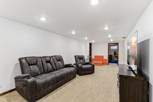 The newly finished lower-level family room feels bright and inviting.