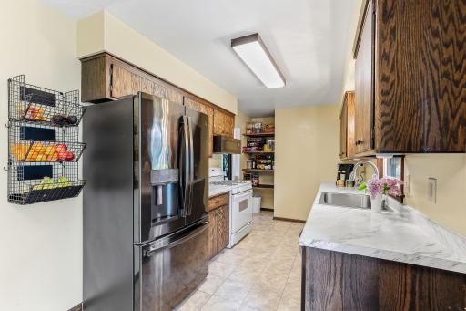 Refreshed kitchen with updated counter tops, new sink and newer appliances.