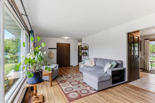 Living room sits just steps from the dining room, creating an easy, natural flow between lounging and dining areas.