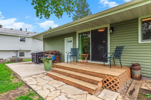 Dining room sliding glass door opens to a charming deck that steps down to a versatile NEW concrete patio (2020)