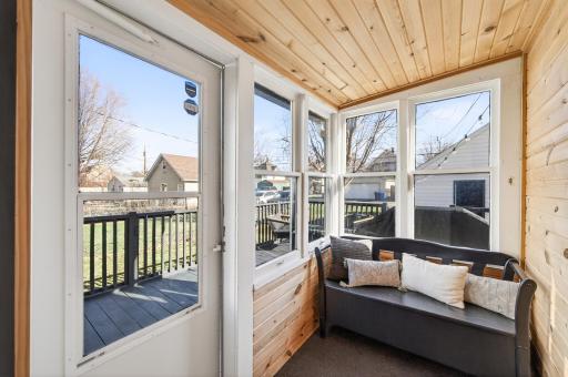 Back porch, sunroom entry with beautiful wood details.