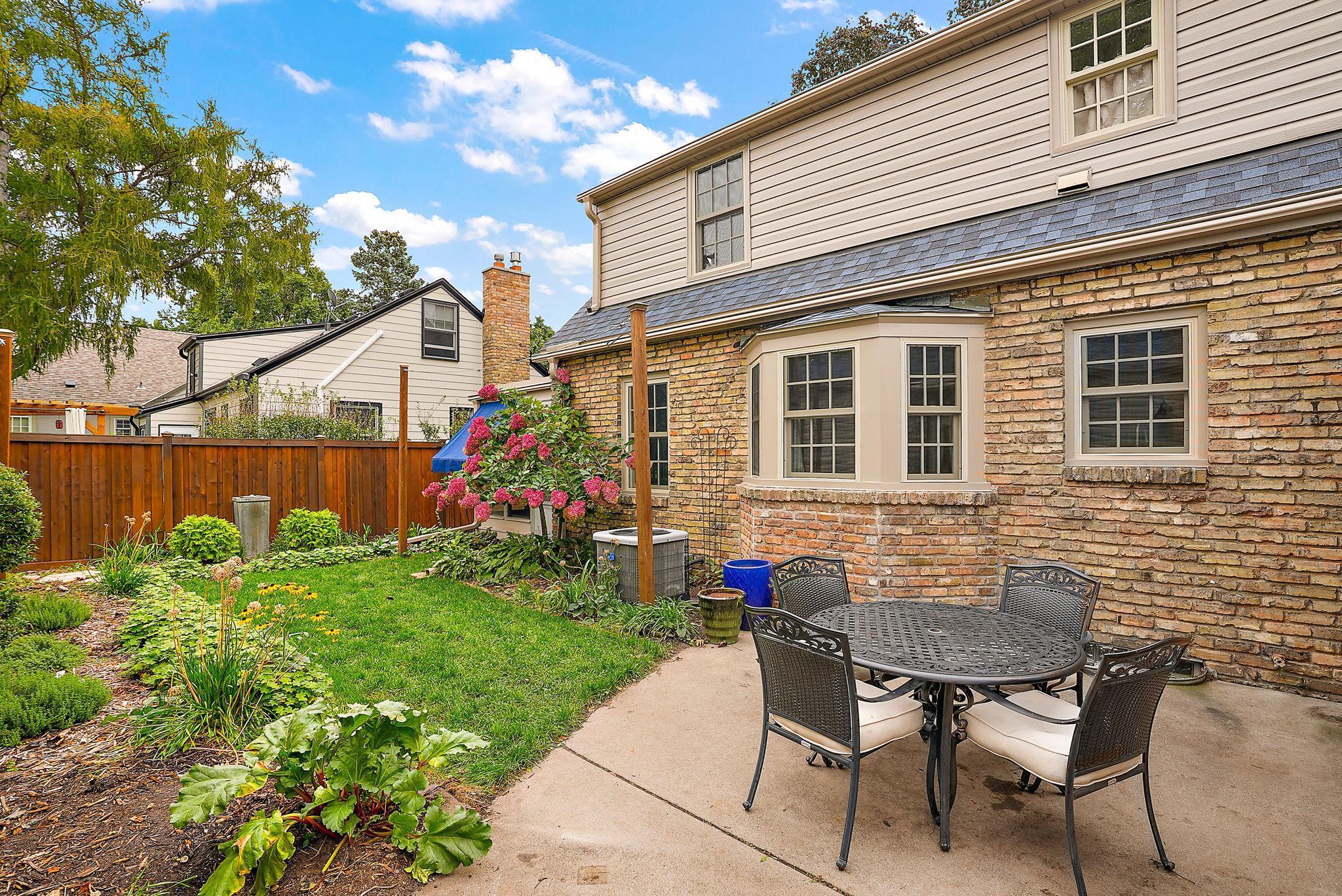Concrete patio adjacent the kitchen