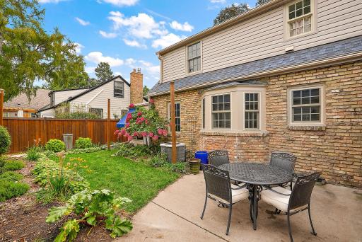 Concrete patio adjacent the kitchen