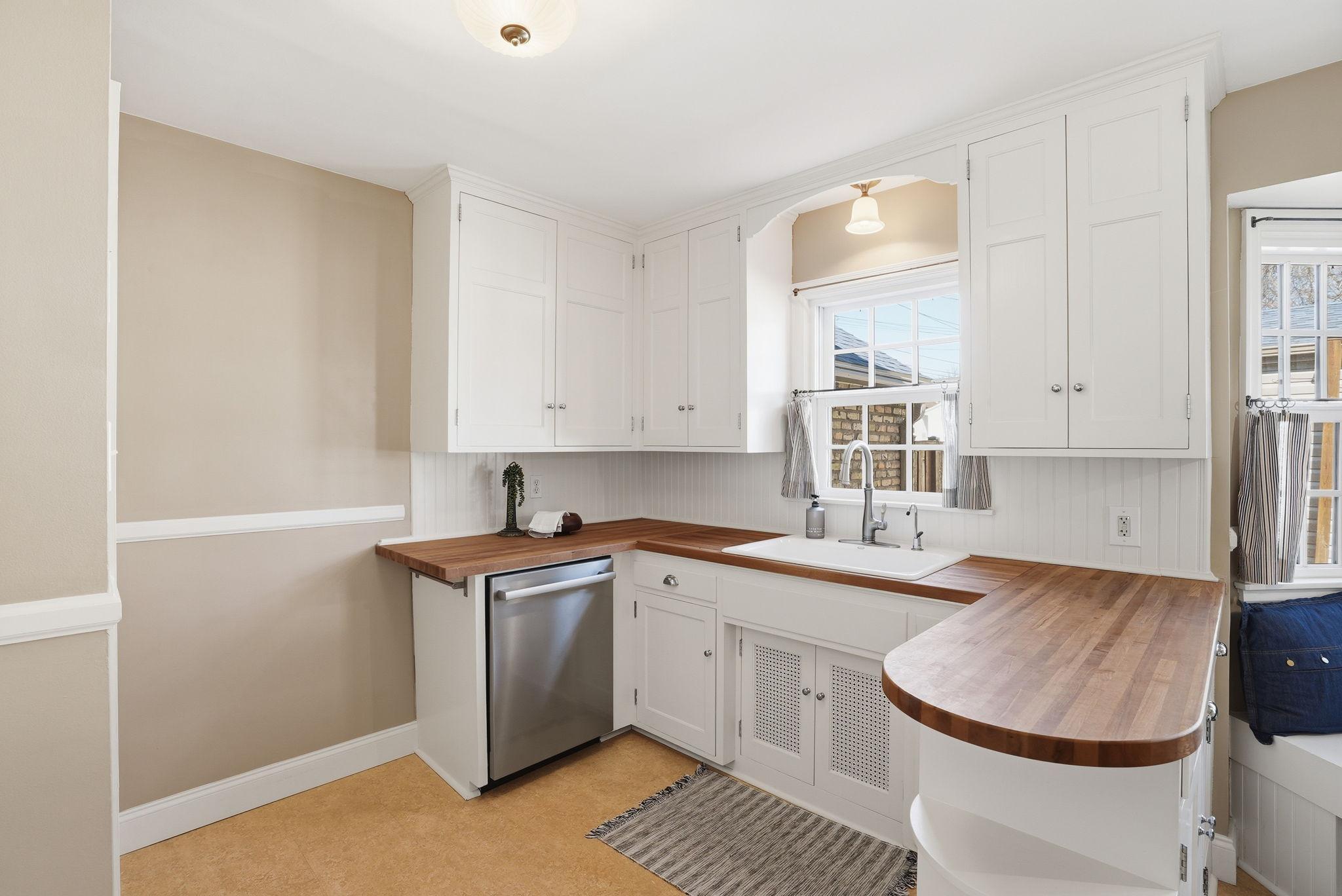 Kitchen window overlooks back patio