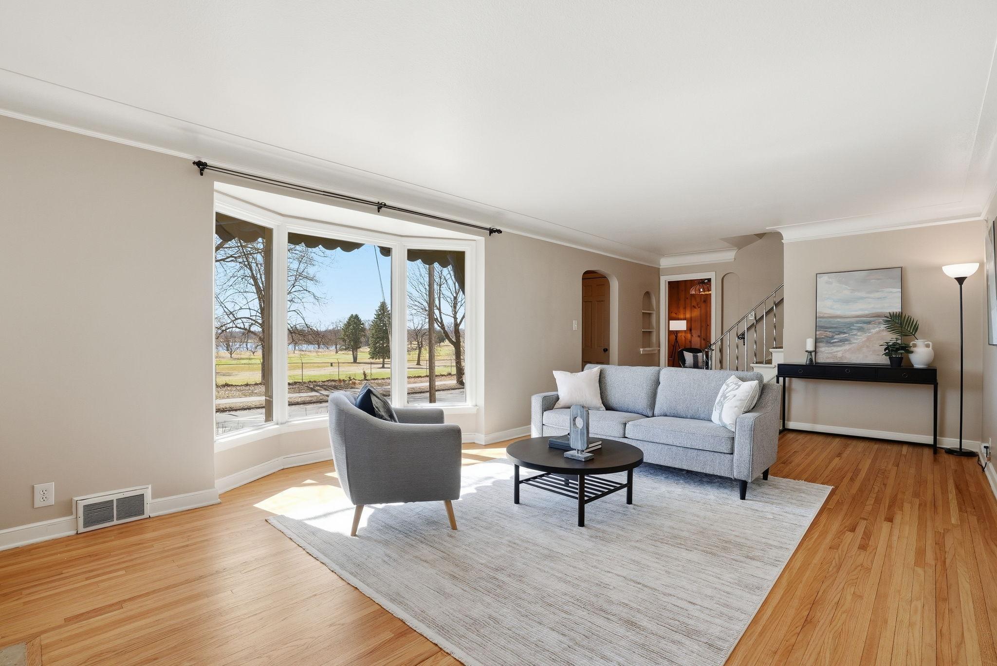 Living room with lake and golf views