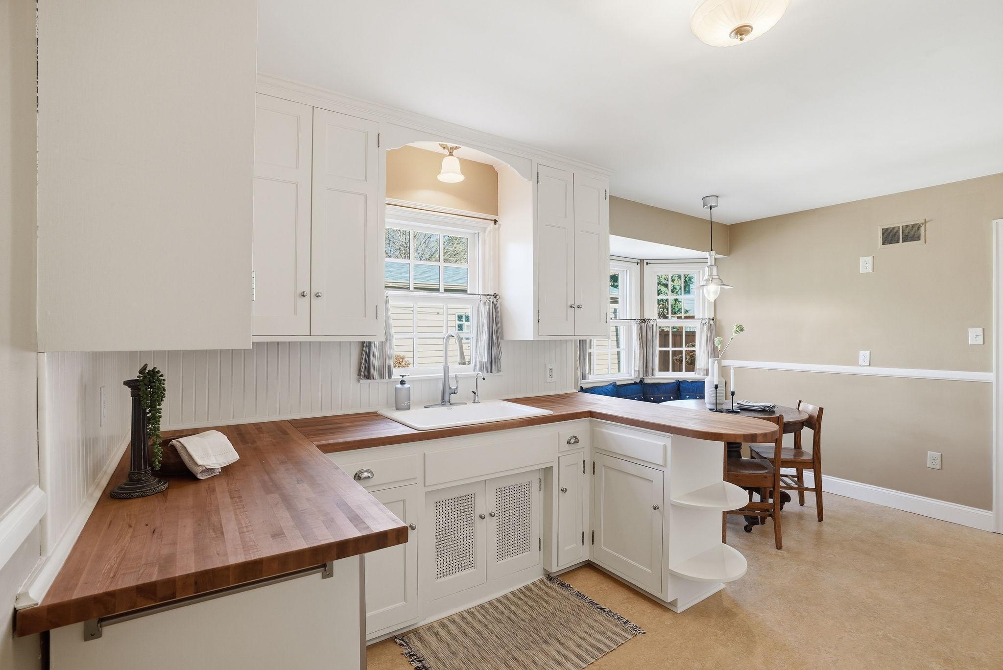 Spacious kitchen with cabinets to ceiling