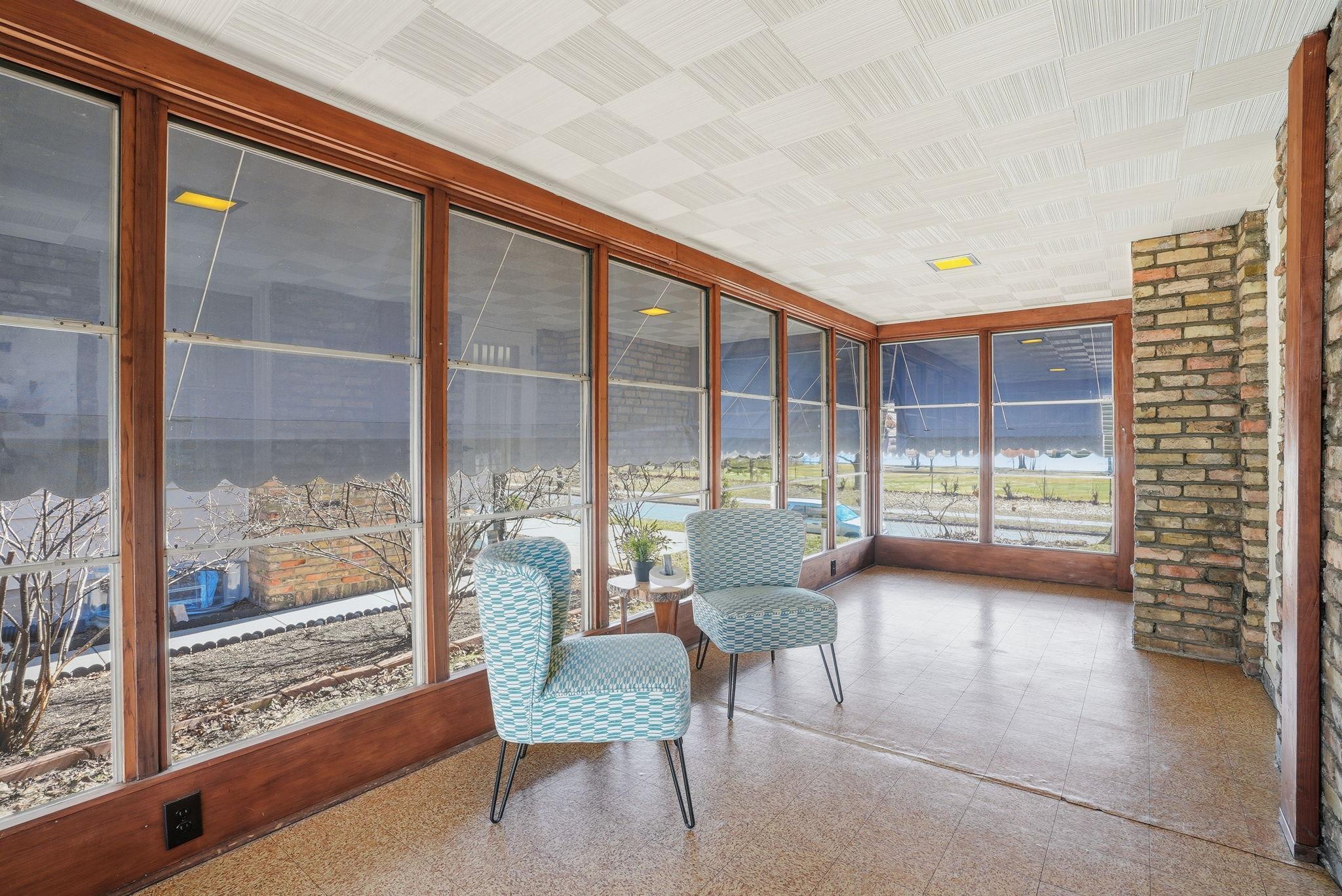 Three season porch overlooks the lake & golf course