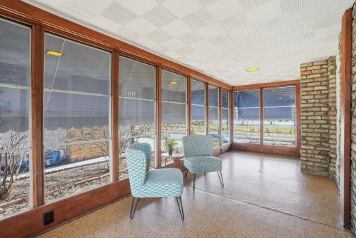 Three season porch overlooks the lake & golf course