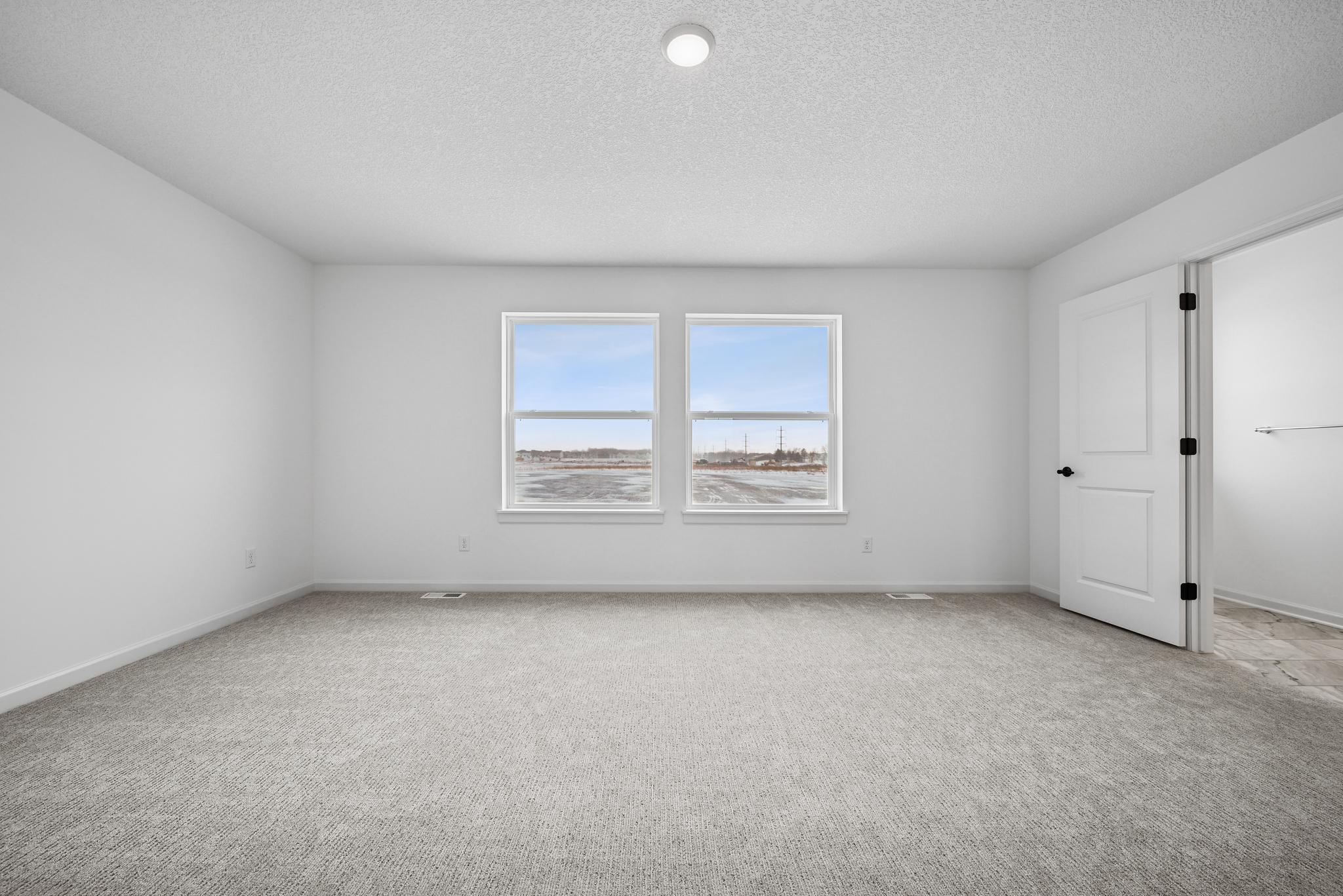 The Owner’s Retreat provides a peaceful escape from the day, offering a spacious and comfortable bedroom designed for rest and relaxation. **Photo of similar home**