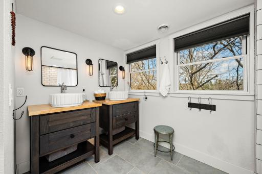Upper level bathroom features 2 sinks and plenty of space