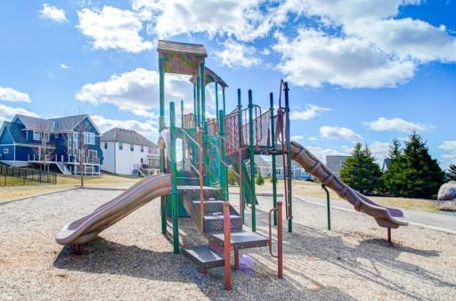 Nearby playground space is another amenity of this association.