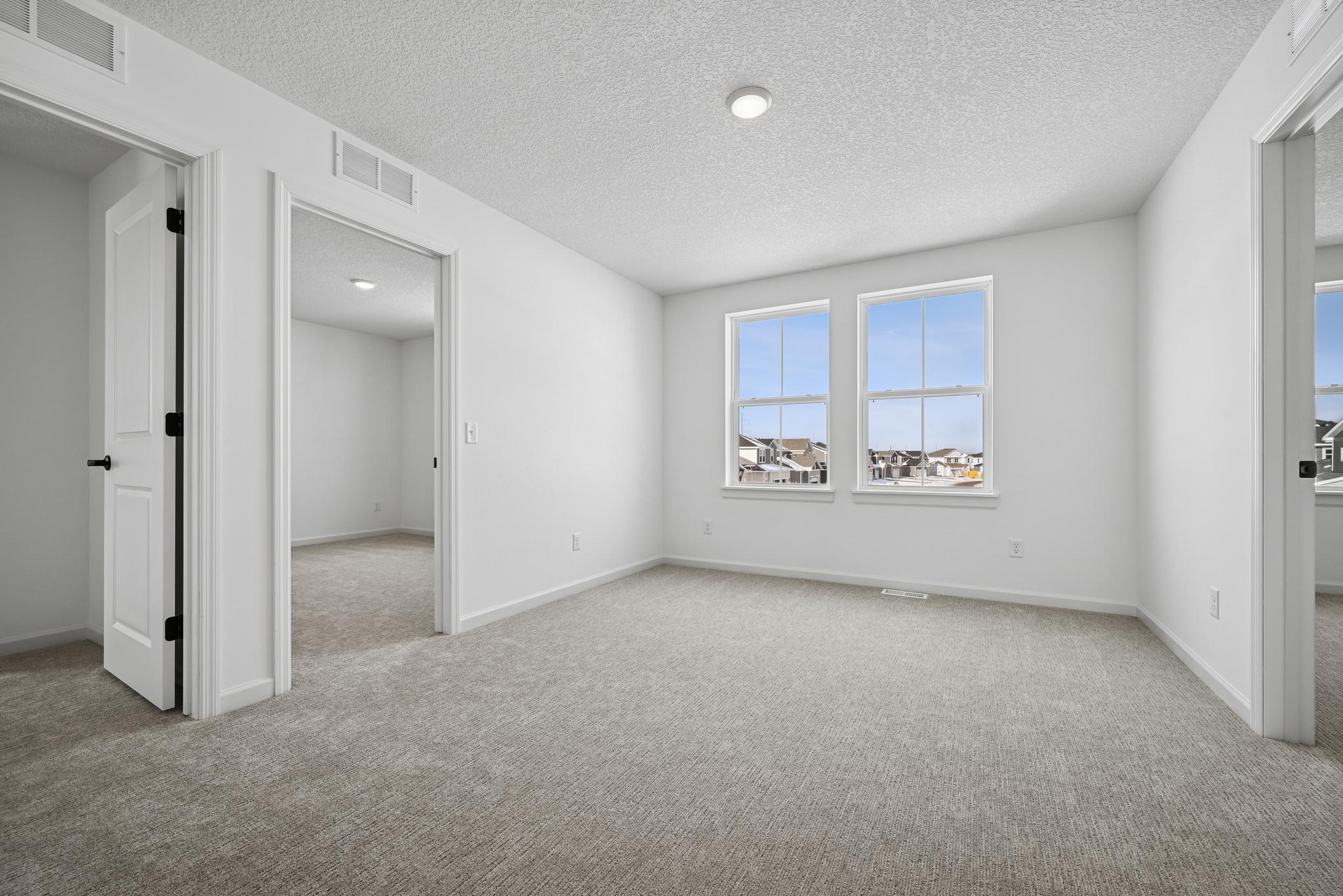 The upstairs loft offers a flexible and inviting living area that can easily adapt to your lifestyle. **Photo of similar home**