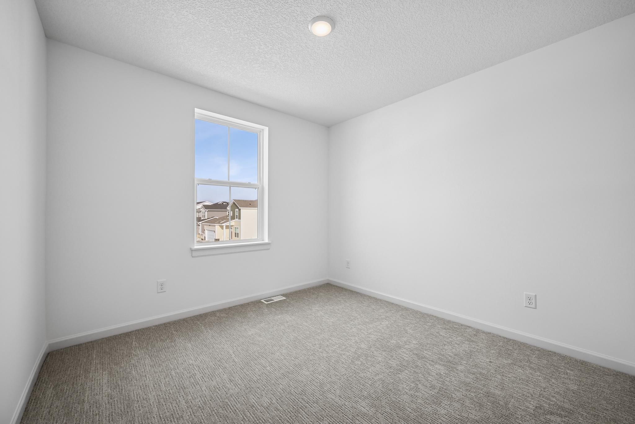 Thoughtfully designed secondary bedroom provide flexible living options for family members or guests. **Photo of similar home**