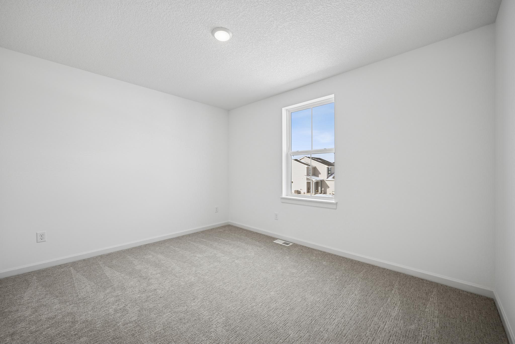 Thoughtfully designed secondary bedroom provide flexible living options for family members or guests. **Photo of similar home**