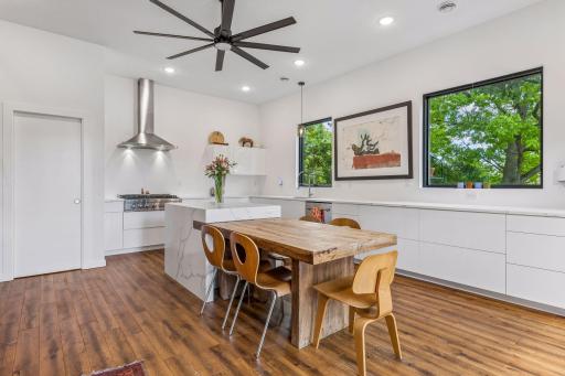 The kitchen includes custom build cabinetry. Center island adds additional space for baking, cooking and eating-in