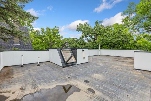 Roof is lined with industrial grade rubber. Great opportunity to create additional outdoor space