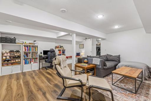Finished lower level includes a cozy family room, 1/2 bath, and laundry/office space