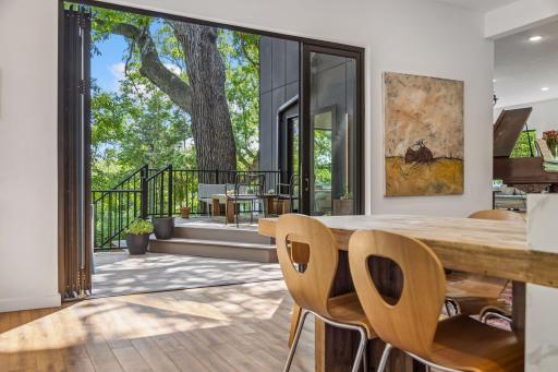 Kitchen opens up to large outdoor deck area